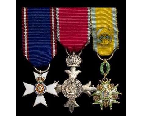 The mounted miniature M.V.O., M.B.E. group of three worn by Miss A. David, whose career in the Foreign Office spanned decades