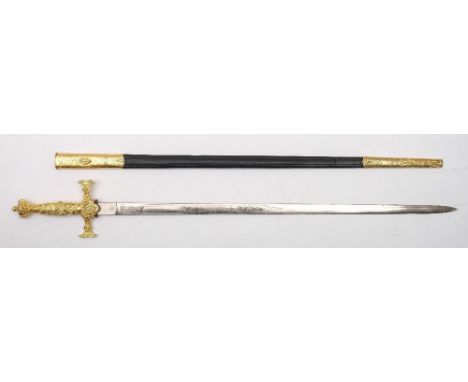 A Masonic court sword:, the straight double edged blade with acid etched decoration over a cast gilt brass hilt with shaped q