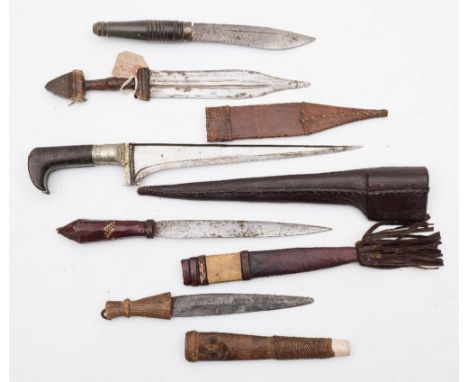 A late 19th/early 20th century pesh kabz:, of traditional form with geometric decorated grip in a leather scabbard, together 