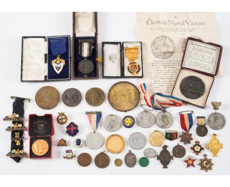 A collection of Victorian and later Commemorative medallions:, together with various enamel badges and lapel badges, Primrose