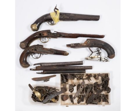 A collection of 18th century and later flintlock and percussion cap pistol fittings including parts for a Sea Service pistol 
