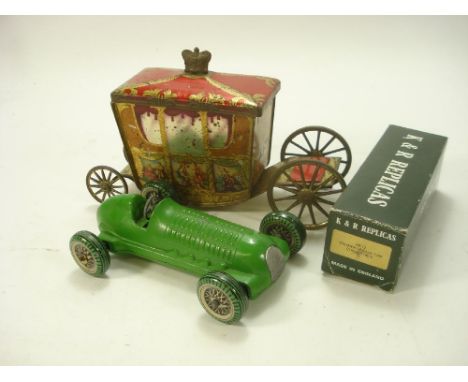 Mettoy. A clockwork diecast racing car:, green with silvered radiator and tinplate litho printed wheels, together with a 1937