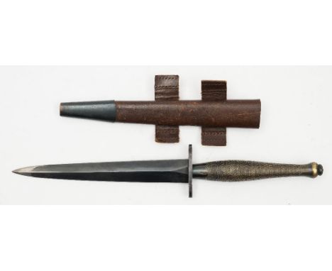 A WWII period Fairbain Sykes Commando knife, second pattern:, the double edged blade over oval hilt and one piece chequered g