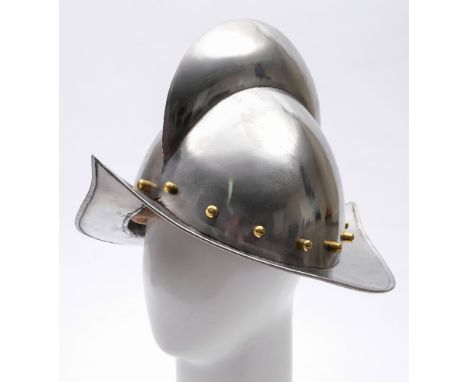 A reproduction Spanish morion helmet:,  20th century with broad comb, brass studs and a wide rim, brown leather lining 25cm h