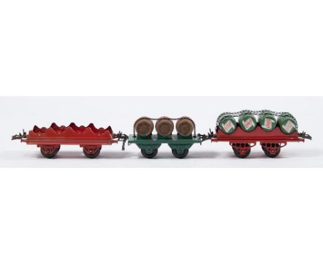 Hornby O gauge, a group of seven goods wagons:, two 'Blue Circle' cement wagons, a 'Meccano' rotary tipping wagon, a 'McAlpin
