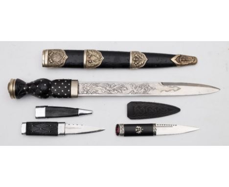 A Scottish military pattern dirk:, the straight blade with false edge to point  with scroll and thistle decoration, over a ca