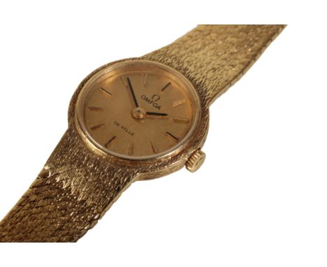 AN OMEGA DE VILLE  18CT GOLD LADY'S BRACELET  WATCH with manual wind movement, the gold dial with gold baton numerals and gol