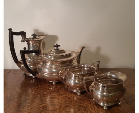 George V silver matched four piece tea service, with gadrooned rims and squat bulbous bodies, comprising teapot, hot water po