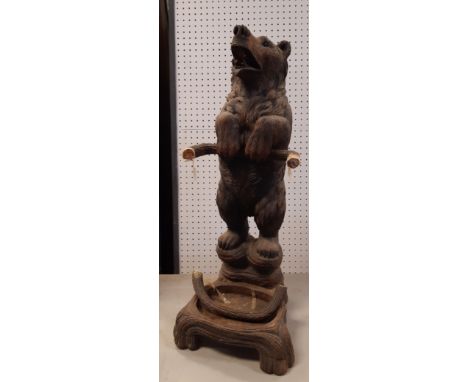 19th Century Swiss 'Black Forest' carved and stained pine stick stand, modelled as a standing bear, 81cm high, damaged and wi