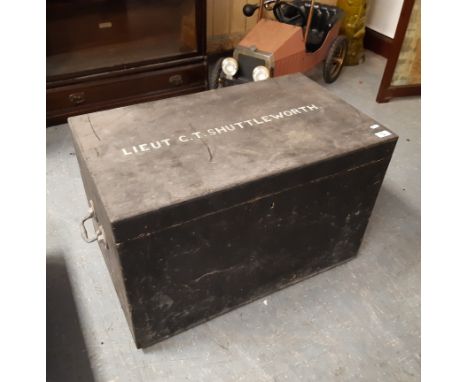 Black painted wooden two handled trunk, worded in white 'Lieut C.T. Shuttleworth', 71cm x 42cm x 48cm high, slight woodworm d