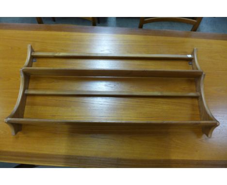 An Ercol Blonde plate rack 