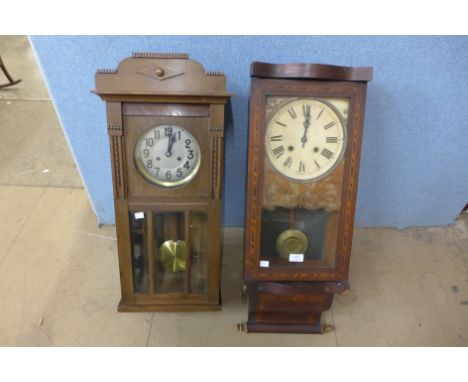 An Edward VII inlaid mahogany wall clock and an oak wall clock 