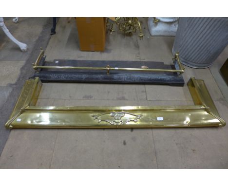 A brass fender and a cast iron and brass fender 