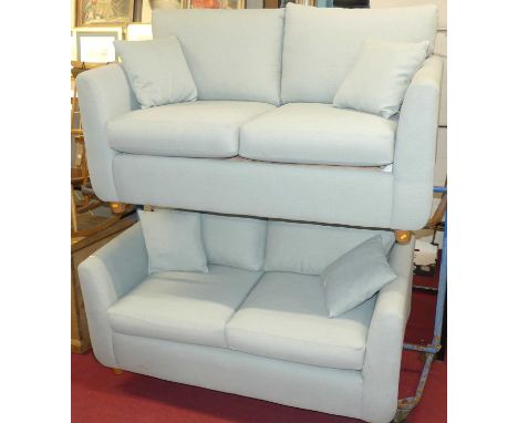 A contemporary pale blue fabric upholstered two-seater sofa by Glasswells, having squab cushions, width 167cm, together with 