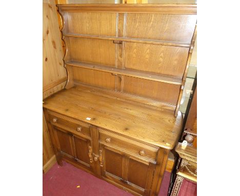 An Ercol dark elm dresser, width 120cm
