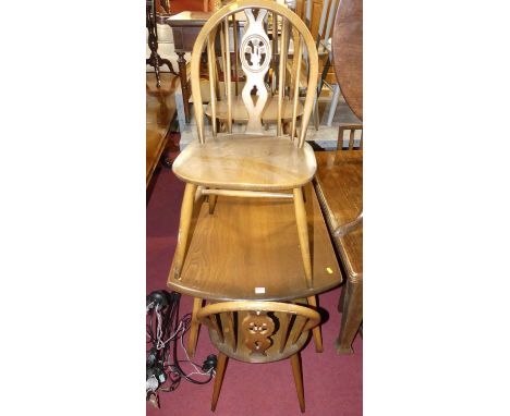 An Ercol dark elm breakfast suite, comprising; drop flap table and a set of four chairs (5)