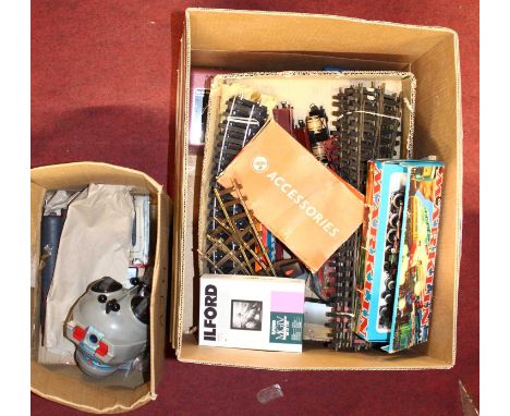 Three boxes containing 0 and 00 gauge related trains, accessories and others to include Hornby Railways double track level cr