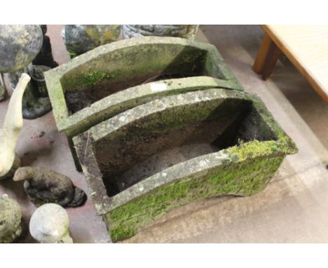 A PAIR OF STONE GARDEN BRIDGE PLANTERS 