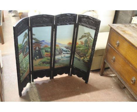 AN ORIENTAL STYLED FOLDING FIRE SCREEN 