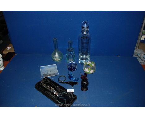 A tall clear glass Decanter, bottles, animals etc.