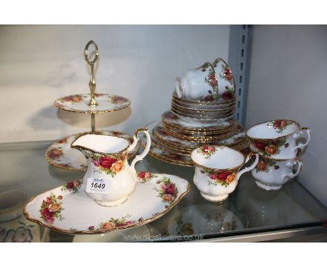 A quantity of Royal Albert 'Old Country Roses' china including dinner, salad and tea plates, cups, saucers, milk jug, cake pl