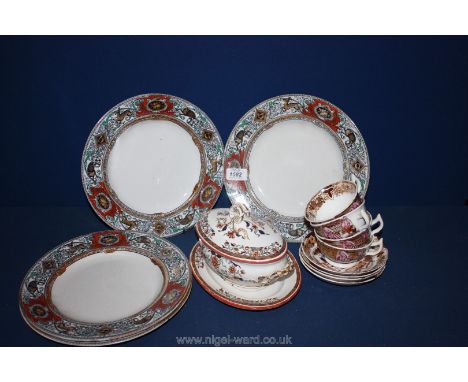 Four oriental Cups and saucers, plates and sauce pot with lid.