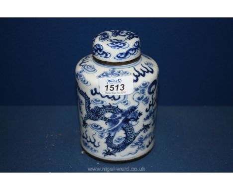 A blue and white oriental covered Tea Caddy with five toe dragons decoration and four character mark .