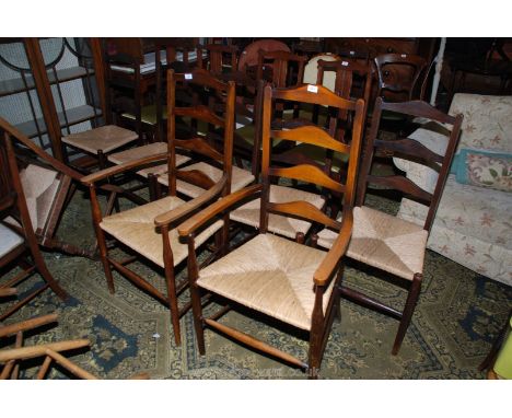 A modern set of six Mahogany ladder back Dining Chairs, the chairs having three rung backs, the carvers having four rung back