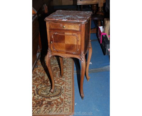 A circa 1900 French Walnut marble top Pot Cupboard, the brown marble lozenge shaped top in a moulded surround over half venee
