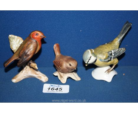 Three Goebel bird ornaments including Blue Tit, Robin and Wren, with impressed marks.