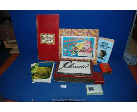 A box of miscellaneous games including Maskolyne's Mysteries Conjuring Tricks, Cluedo (no board), playing cards, etc.