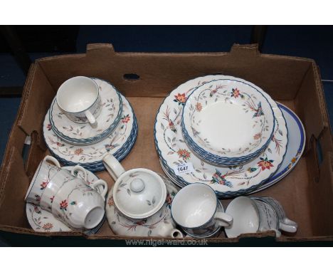 A part Dinner and Tea service in ornamental bird design including dinner plates, bowls, teapot, cups and saucers, etc.