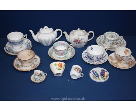 A quantity of Cups, saucers and teapots including small white Shelley teapot, Sadler teapot, Coalport cups and saucers, etc.