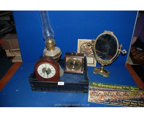 A quantity of miscellanea including a brass dressing table swing mirror, Smiths clock, Metamec clock, Queen Elizabeth II coro