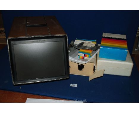 A Polaroid Polarvision Land Camera and Projector with two spare tapes.