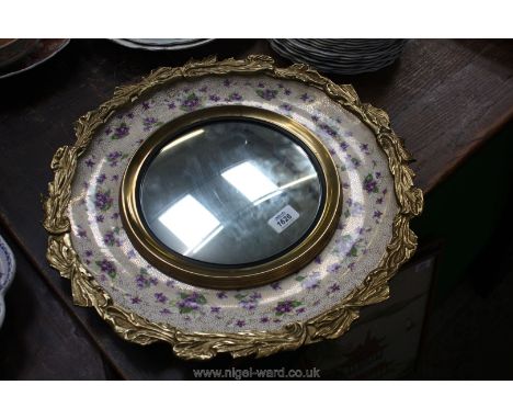 A large china Wall Plaque by A.J. Wilkinson decorated with violets and with a mirror to the centre, and gilt metal surround