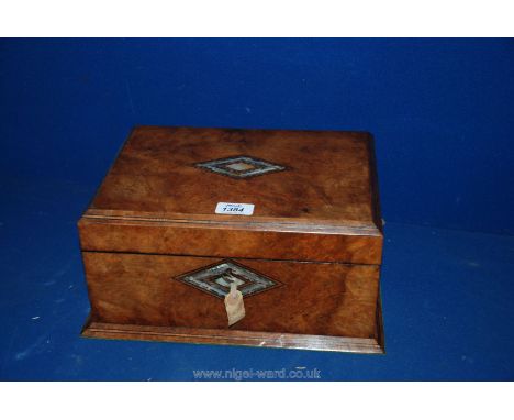 A Walnut Sewing Box with Mother of Pearl inlay.