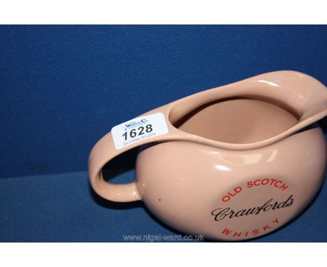 Two old pink Crawford's Scotch Whisky jugs and a blue jug 'Take a peg of John Begg'.
