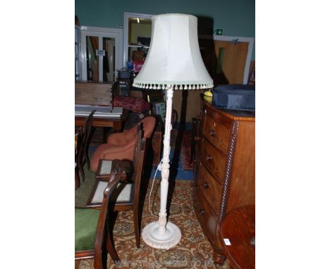 A reproduction Empire style Standard Lamp having white and gold painted fluted urn turned column, with cream shade edged with