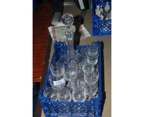 An Edwardian Decanter with Greek Key etched design and twelve Sherry glasses in various shapes.