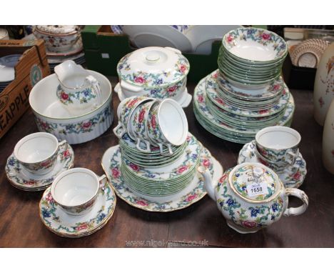 A large quantity of Booths 'Floradora' tableware including breakfast and dinner services, teapot, cups, saucers, plates, vege