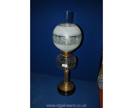 A clear glass Oil Lamp with globe and chimney