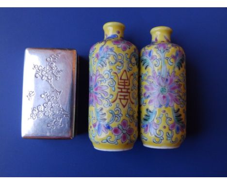 A pair of Chinese yellow ground porcelain cylindrical snuff bottles with red printed four character marks, 2.75” together wit