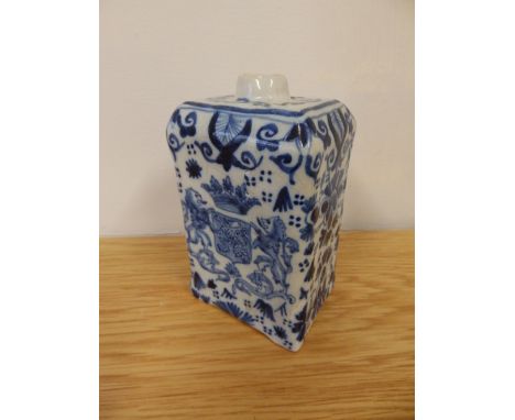 A 19thC blue &amp; white delft armorial caddy, 4.5” high.