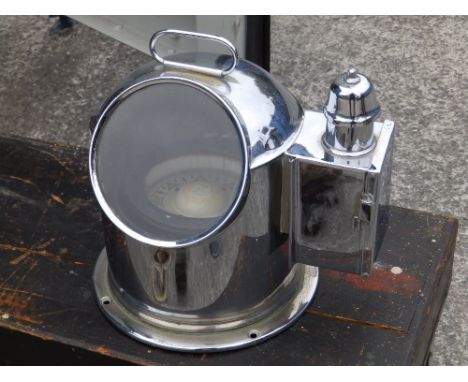 A 1920's ship's chrome plated compass with oil lamp on side.