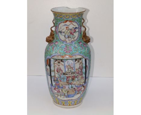 A 19thC Chinese famille rose porcelain vase, having tiger handles to shoulders, panels depicting Imperial figures and warrior