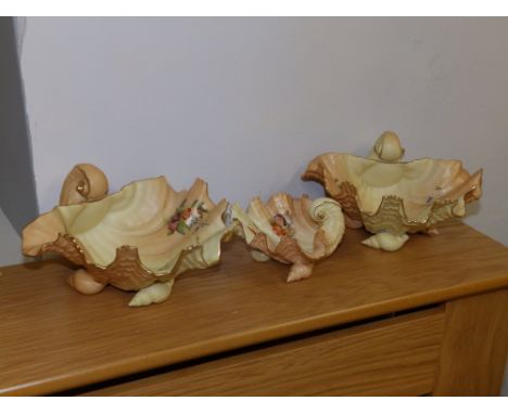 A pair of Royal Worcester porcelain blush ivory shell dishes decorated flowers and one smaller, matching – G971.  (3)
