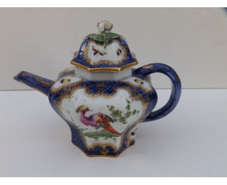 A Worcester style small porcelain teapot decorated exotic birds with scale blue ground – fretted square mark in underglaze bl