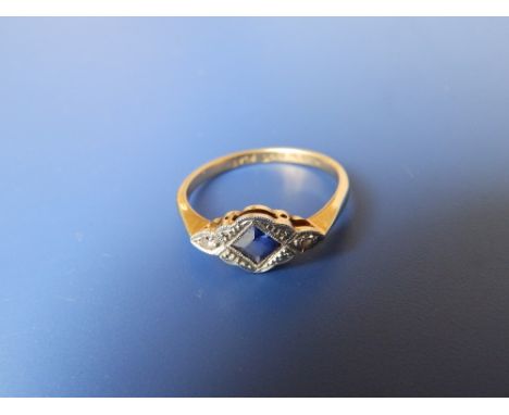 A small sapphire &amp; diamond '18ct Plat' ring. Finger size O.