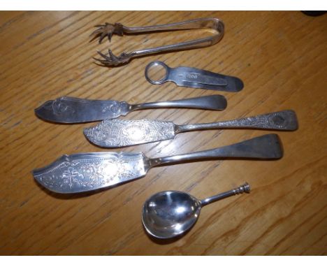 A plain silver seal top caddy spoon, 1902, three butter knives, a pair of tongs and a bookmark. (6)